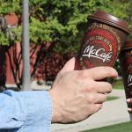 People toasting with Double-walled McCafe Hot Cups